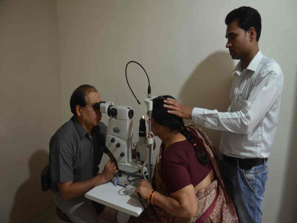 Doctor checking a patient with ophthalmic equipment